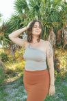 woman wearing tank top near palm tree