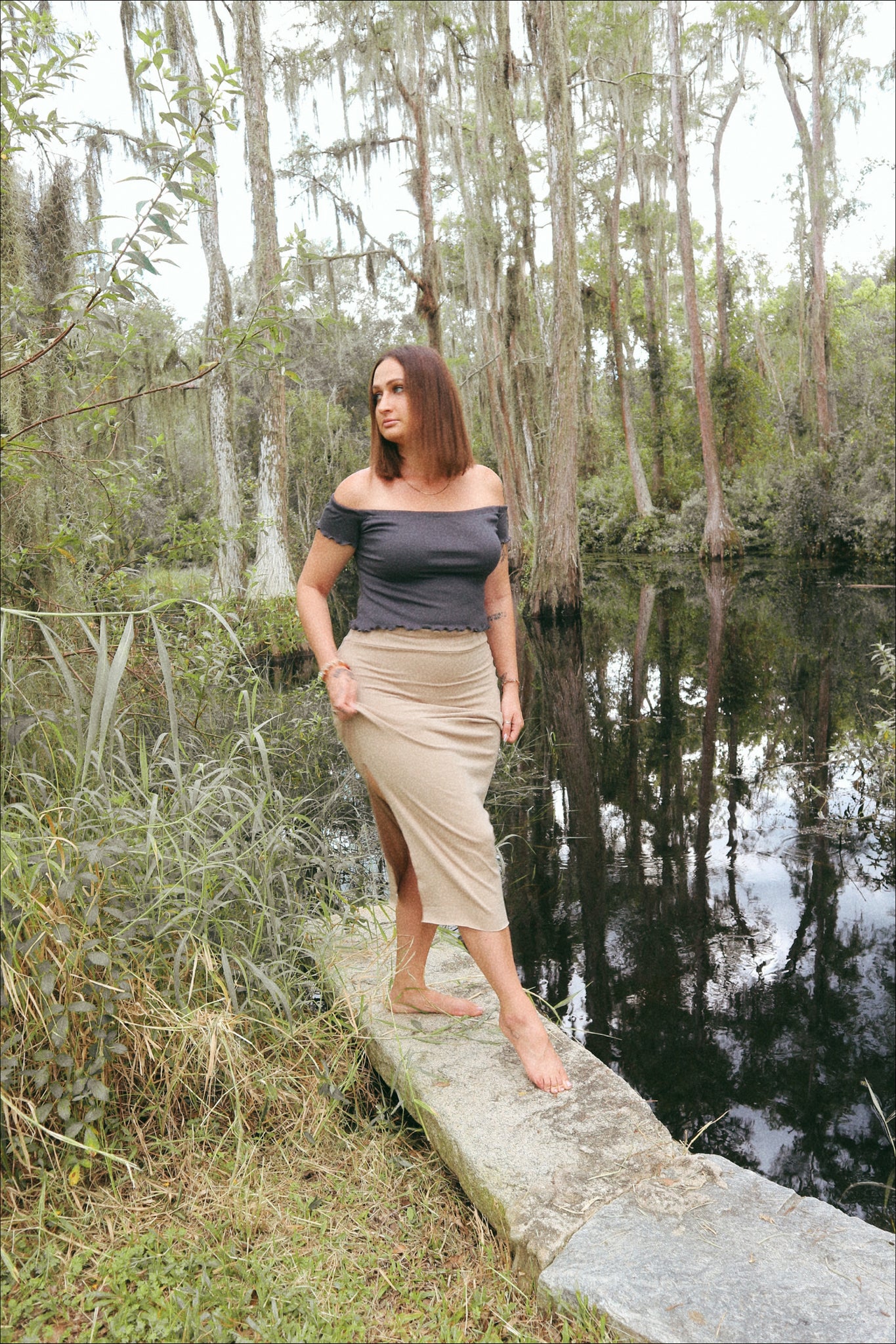 woman walking on edge of pond