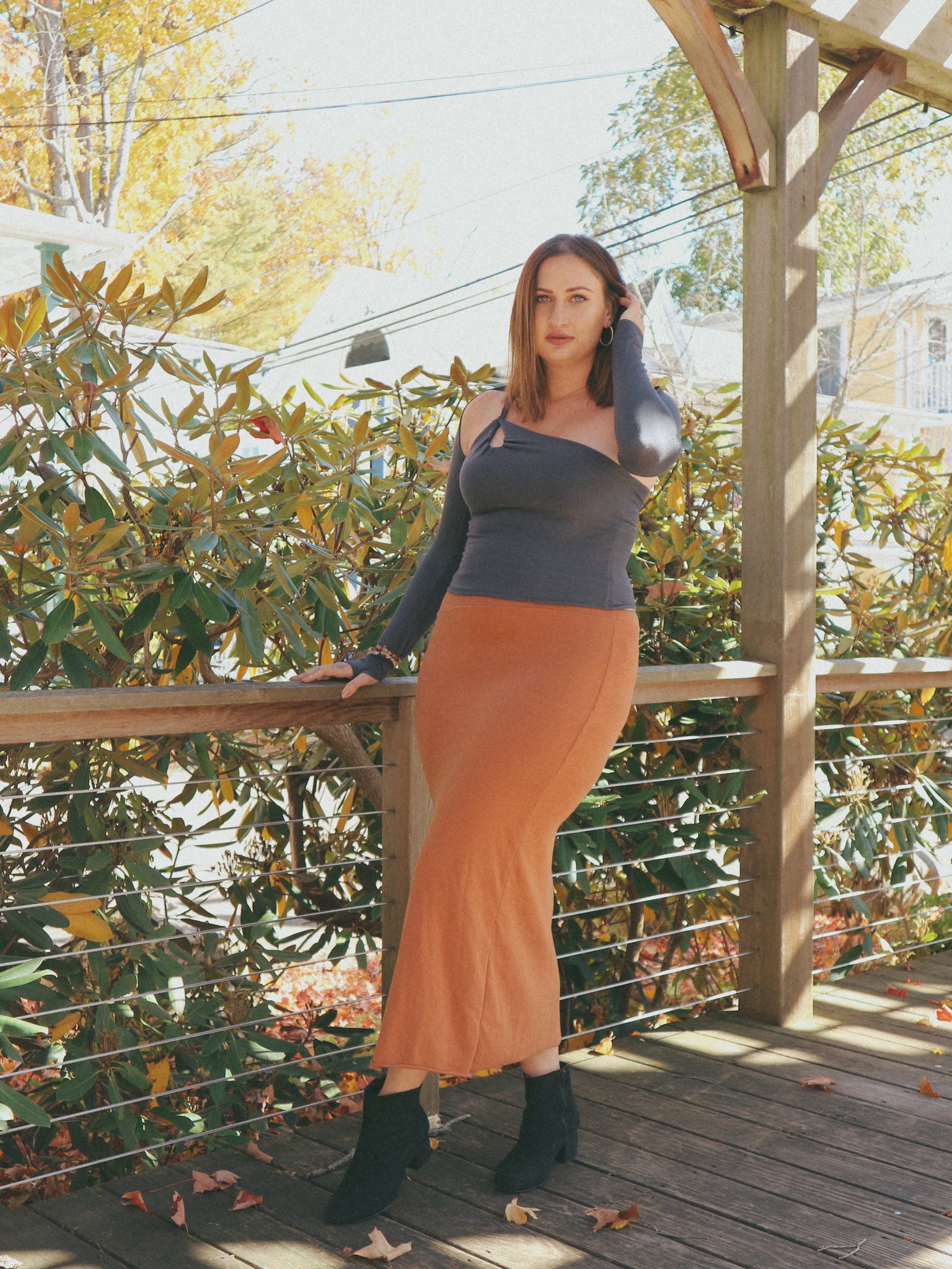 woman outdoors wearing skirt